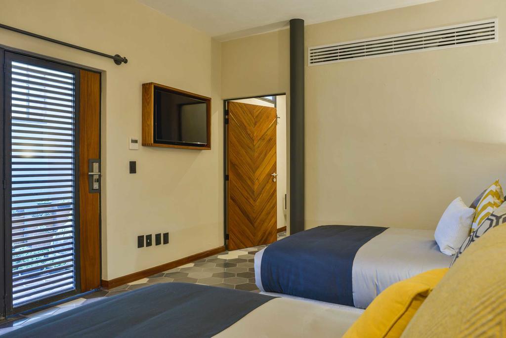 Hotel Criol Queretaro Luaran gambar A room at the hotel